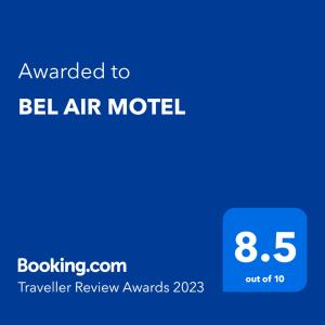 a blue sign that says awarded to bell air motel at BEL AIR MOTEL in Wood River