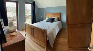 Postel nebo postele na pokoji v ubytování Gîte Banet-Sart à Daverdisse