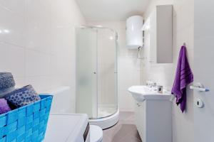 a bathroom with a shower and a toilet and a sink at Apartment Anamaris in Solin