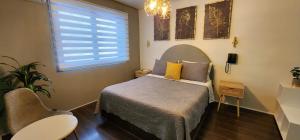 Postel nebo postele na pokoji v ubytování Hotel Voila la Moneda