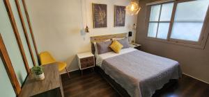 Postel nebo postele na pokoji v ubytování Hotel Voila la Moneda