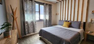 Postel nebo postele na pokoji v ubytování Hotel Voila la Moneda + 22 fotografií