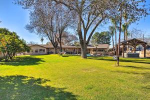 a park with trees and a building in the background at Spacious Glendale Home with Outdoor Kitchen! in Glendale