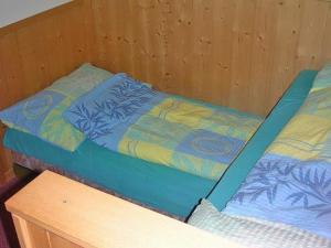 מיטה או מיטות בחדר ב-Adler 2 Bett Wohnung