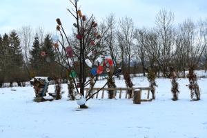 a christmas ornament tree in a snow covered field at Roua de sub Creasta in Breb