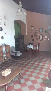 a living room with a checkered floor at Casa Vieja Guest House in Santa Ana