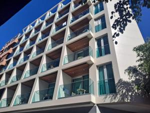 an external view of a building with balconies at RK Farallón Canteras in Las Palmas de Gran Canaria