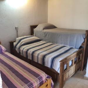 Habitación con 2 camas individuales en Cabaña Mimi en Luján de Cuyo