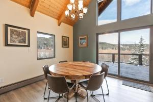 a dining room with a wooden table and chairs at The Fishermans Place Peaceful with Mountain Views in Breckenridge