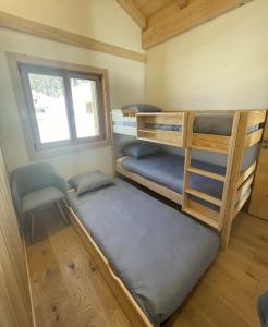 Postel nebo postele na pokoji v ubytování Chalet Clos du Nant Megève