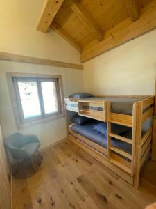 Postel nebo postele na pokoji v ubytování Chalet Clos du Nant Megève