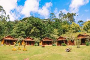 Um jardim em Pousada Cabanas da Serra Lumiar