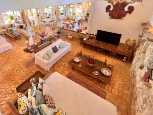 an overhead view of a living room with couches and a television at Vilatoro Guest House in Ilhabela