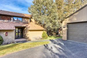 a house with a garage and a driveway at Robin Court Retreat in Redmond