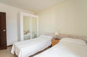 Posteľ alebo postele v izbe v ubytovaní APARTAMENTOS CASA EUGENIO FORMENTERA
