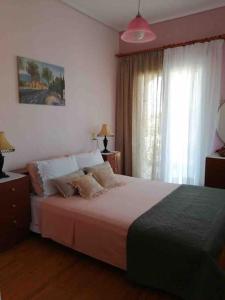 Postel nebo postele na pokoji v ubytování Σπίτι με απεριόριστη θέα