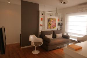 a living room with a couch and a chair at Funky & Stylish Apartment Palermo in Buenos Aires