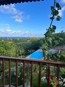 a view from the balcony of a resort with a swimming pool at Pousada Pipa Imperial in Pipa