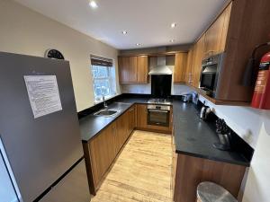 Køkken eller tekøkken på Jolly Roger Cottage