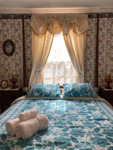 Postelja oz. postelje v sobi nastanitve St. George Hotel