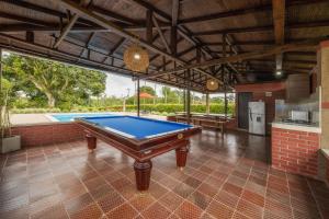 a pool table in the middle of a room at Finca el Bosque in Montenegro