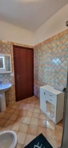a bathroom with a sink and a toilet at Amici di Calabria in Scalea +48 photos