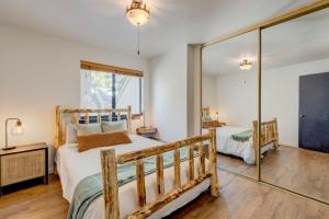 a bedroom with two beds and a mirror at Alder Grove in Incline Village