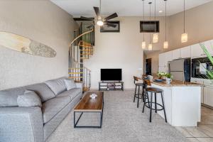 a living room with a couch and a table at Kihei Park Shores 13 in Kihei