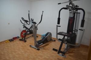 a gym with three exercise bikes on the floor at LA CALDERETA CASA RURAL in La Oliva