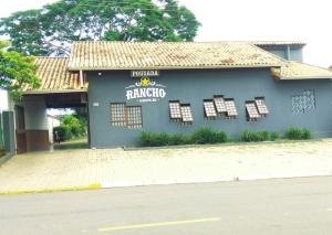 a blue building with windows on the side of it at Pousada Rancho Bonito in Bonito