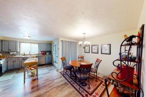 a kitchen and dining room with a table and chairs at Hayward Home in Eugene