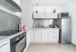 Kuchyň nebo kuchyňský kout v ubytování Appartement design La Petite Europe - Idéal Curistes
