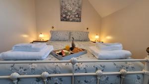 Postel nebo postele na pokoji v ubytování Puddleduck Cottage + 37 fotografií