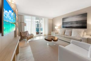 a living room with a couch and a table at Oceanview Private Condo at 1 Hotel & Homes -1211 in Miami Beach