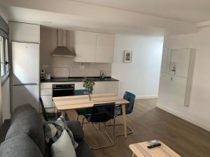 a living room with a couch and a table at Apartamentos Central B in Algeciras +7 photos