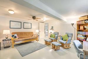 a living room with a couch and two chairs at Cozy OBrien Home with Fire Pit and Patio Near Rivers! in Branford