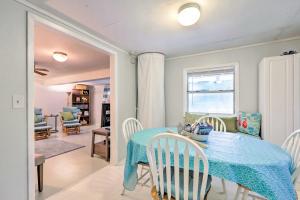 a dining room with a blue table and chairs at Cozy OBrien Home with Fire Pit and Patio Near Rivers! in Branford