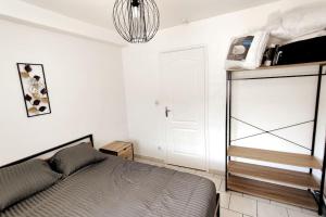 Posteľ alebo postele v izbe v ubytovaní Appartement style industriel au centre de Douai