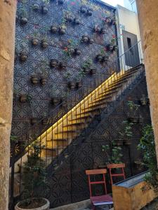a staircase with plants on the side of a building at Carlota Sustainable Design Hotel in Quito