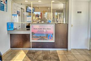 a store front with a sign on the door at Motel 6-Lancaster, CA in Lancaster +28 photos