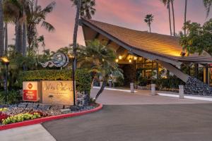 a resort with a sign in front of a building at Best Western PLUS Island Palms Hotel & Marina in San Diego