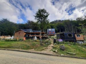 a group of houses on the side of the road at Cabaña del Glaciar, al pie del glaciar vinciguerra zona ramsar in Ushuaia