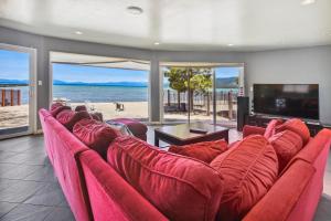 a living room with a couch and a tv and the beach at Private Beach, Pool Table, Close To Everything in South Lake Tahoe