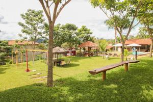 a park with a playground and a swing set at Pousada do Dinho in Esmeraldas