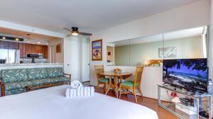 a living room with a couch and a table at Maui Westside Presents: Mahana 1003 in Lahaina