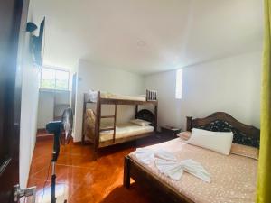 Postel nebo postele na pokoji v ubytování Hotel Caribe La Vega