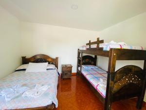 Postel nebo postele na pokoji v ubytování Hotel Caribe La Vega