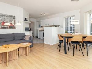 a living room and kitchen with a couch and a table at 5 person holiday home in Bogense-By Traum in Bogense