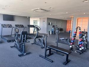 a gym with several treadmills and exercise bikes at APART HOTEL SENSE II - Localizado em Hotel in Manaus
