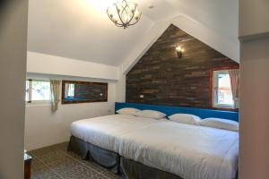 Postel nebo postele na pokoji v ubytování Mushroom Forest Guesthouse Camping Site + 26 fotografií